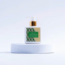 Lotion bottle with green label on a white background